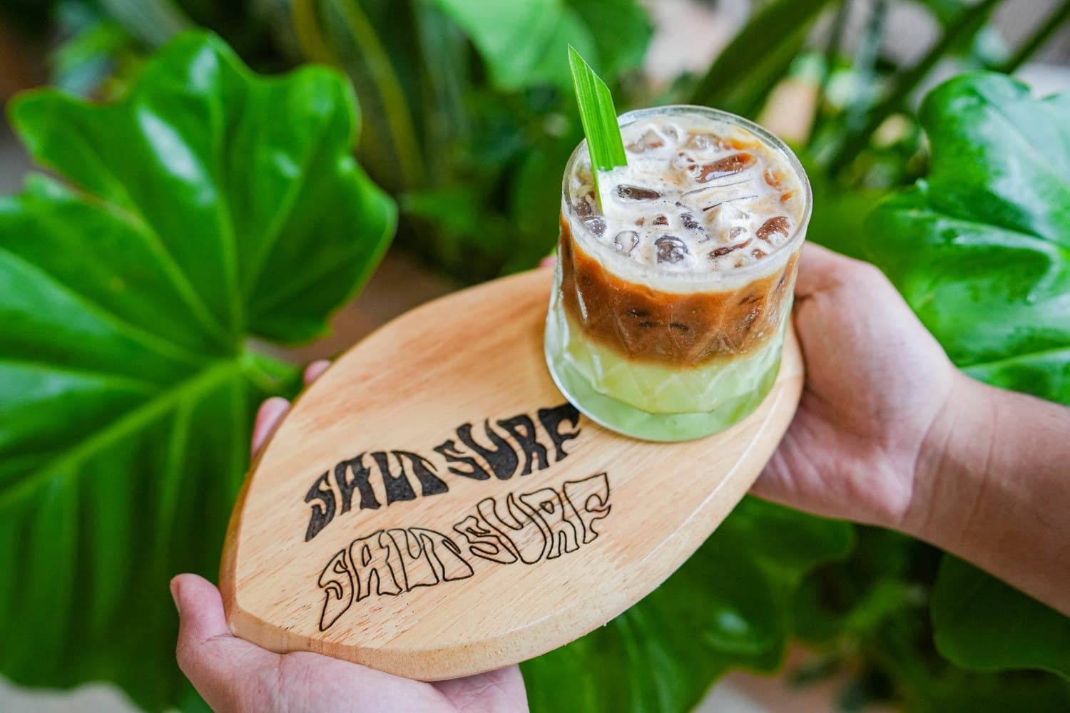 Iced coffee on a surfboard coaster